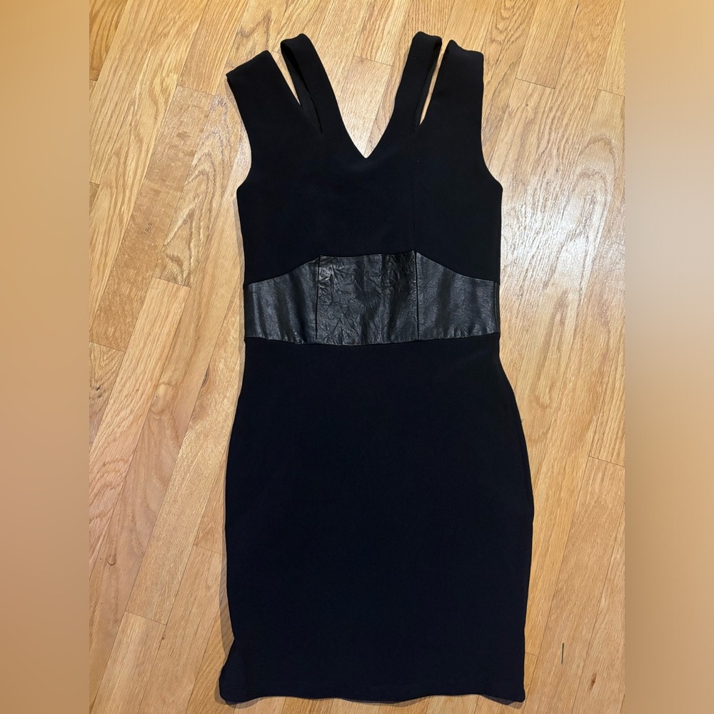 Ribbed black mini dress with leather detailing